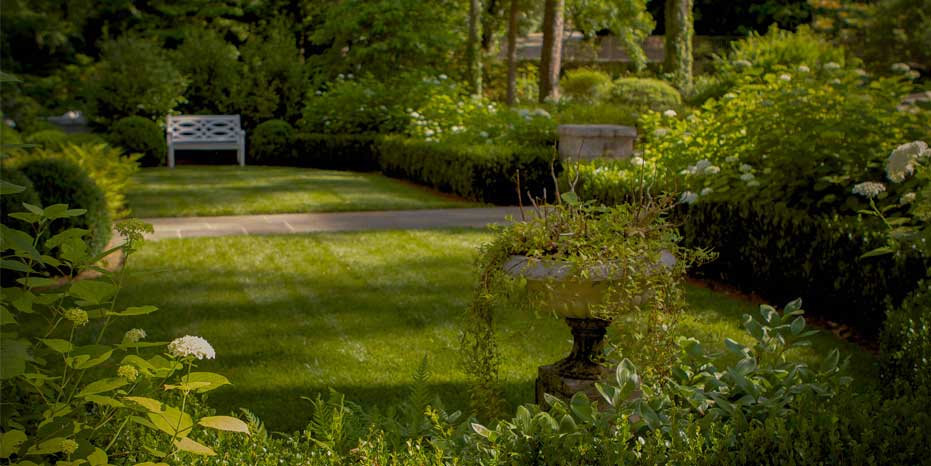 A lush elegant entry courtyard creates an inviting entry way in Buckhead